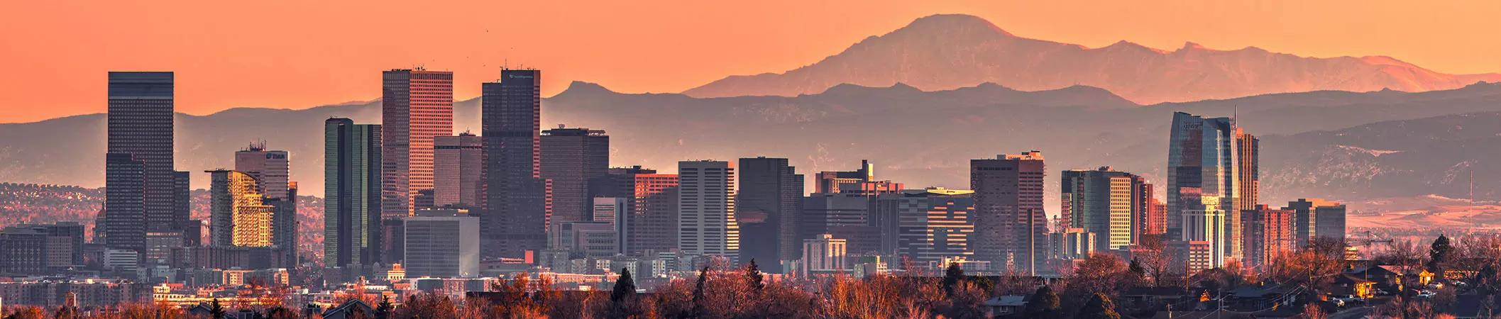 Landscape of Denver and the mountains at sunset