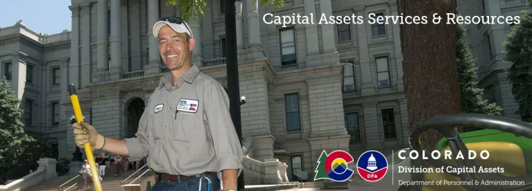 A capitol complex worker smiles outside the Denver capitol. Click to go to Capitol Complex.